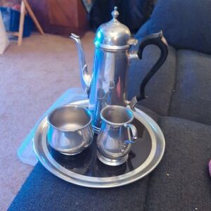 Elegant Silver Tea Set with Black Handles
